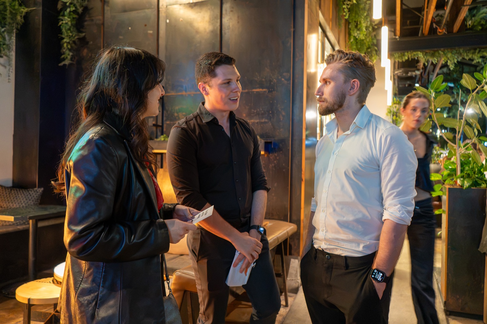 Three guests talking standing at the entrance of Nolita Hall