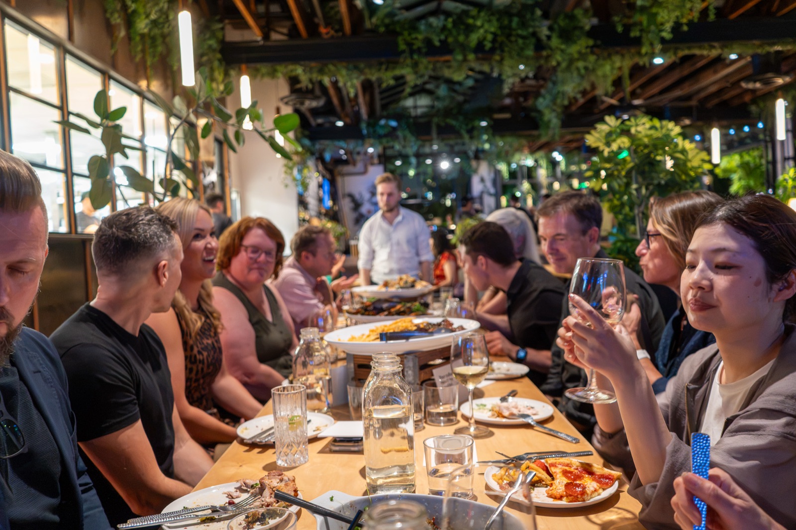 Guests raising glasses along the table